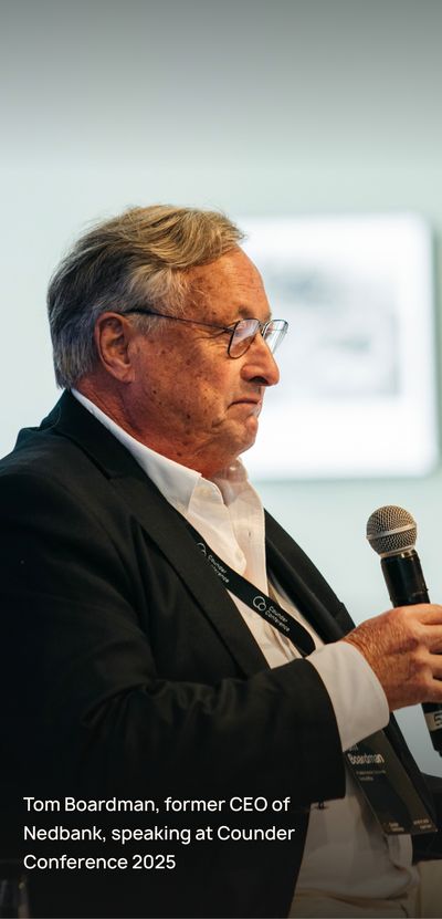 Speaker stands with microphone in hand